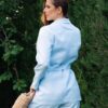 Woman dressed with blue linen jacket and blue long pants
