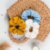 Linen yellow, blue and white scrunchie on a bag