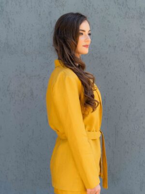 Woman dressed in yellow linen jacket, yellow linen shorts and yellow linen shirt