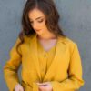 Woman dressed in yellow linen jacket, yellow linen shorts and yellow linen shirt