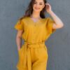 Woman dressed in yellow linen shorts and yellow linen shirt