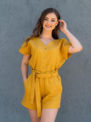 Woman dressed in yellow linen shorts and yellow linen shirt