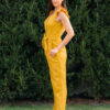 Woman in a garden dressed in linen yellow jumpsuit