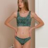Woman dressed in organic cotton green brazilian bikini and green top