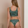 Woman dressed in organic cotton green bikini and green top