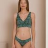 Woman dressed in organic cotton green brazilian bikini and green top