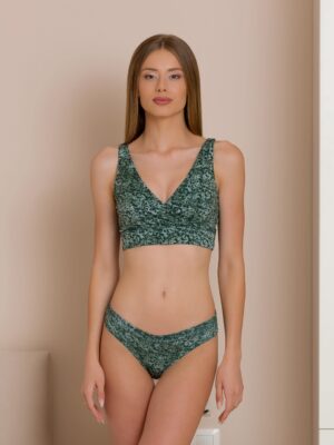 Woman dressed in organic cotton green brazilian bikini and green top