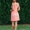 woman wearing short peach dress