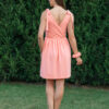 woman wearing short peach dress