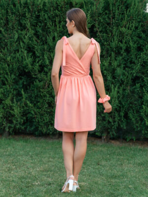 woman wearing short peach dress