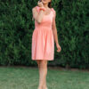 woman wearing short peach dress