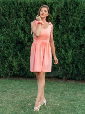 woman wearing short peach dress