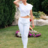 Woman wearing slim fit white organic cotton pants and white t-shirt