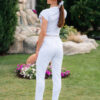 Woman wearing slim fit white organic cotton pants and white t-shirt