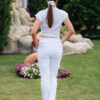 Woman wearing slim fit white organic cotton pants and white t-shirt