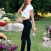 Woman wearing a white t-shirt and balck pants