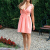 woman wearing a short peach dress