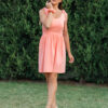 woman wearing a short peach dress
