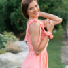 woman wearing a short peach dress