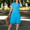Woman wearing a blue wrap dress