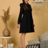 Woman with brown hair wearing organic cotton black hooded dress