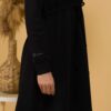 Woman with brown hair wearing organic cotton black hooded dress