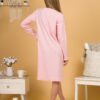 Woman wearing pink organic cotton pajama-dress