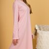 Woman wearing pink organic cotton pajama-dress