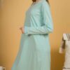 Woman wearing turquoise organic cotton pajama-dress