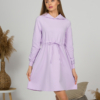 Woman with blond hair wearing organic cotton violet hooded dress