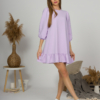 Woman with blond hair wearing violet organic cotton dress with bouffant sleeves