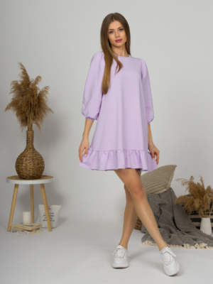 Woman with blond hair wearing violet organic cotton dress with bouffant sleeves