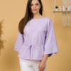 Woman with brown hair wearing violet organic cotton wide sleeves blouse and violet organic cotton long pants