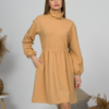 Woman with blond hair wearing organic cotton doe color polo dress