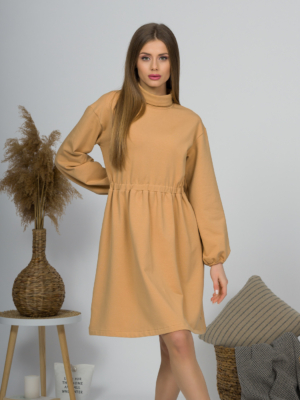 Woman with blond hair wearing organic cotton doe color polo dress