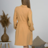 Woman with blond hair wearing organic cotton doe color polo dress