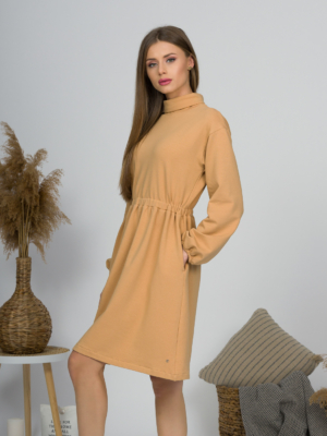 Woman with blond hair wearing organic cotton doe color polo dress