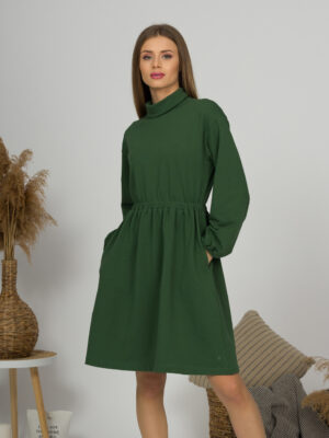Woman with blond hair wearing organic cotton dark green color semi-polo dress