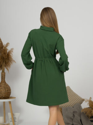 Woman with blond hair wearing organic cotton dark green color semi-polo dress