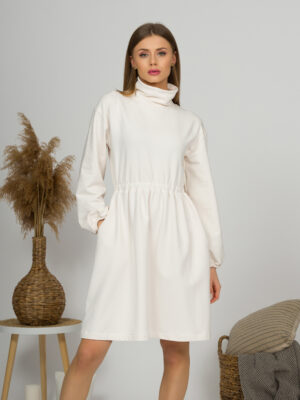 Woman with blond hair wearing organic cotton white semi-polo dress