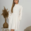 Woman with blond hair wearing organic cotton white semi-polo dress