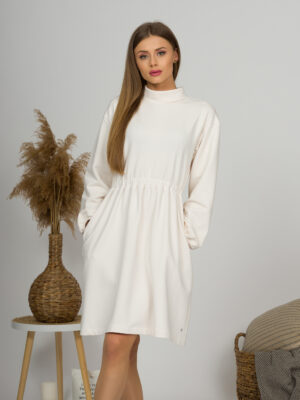 Woman with blond hair wearing organic cotton white semi-polo dress