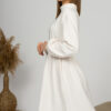 Woman with blond hair wearing organic cotton white semi-polo dress