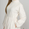 Woman with blond hair wearing organic cotton white semi-polo dress