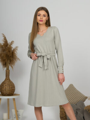 Woman with blond hair wearing organic cotton gray color long sleeves dress with coconut buttons