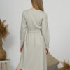 Woman with blond hair wearing organic cotton gray color long sleeves dress with coconut buttons