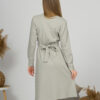 Woman with blond hair wearing organic cotton gray color long sleeves dress with coconut buttons