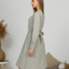 Woman with blond hair wearing organic cotton gray color long sleeves dress with coconut buttons