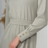 Woman with blond hair wearing organic cotton gray color long sleeves dress with coconut buttons