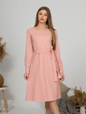 Woman with blond hair wearing organic cotton pink color long sleeves dress with coconut buttons